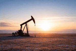 Oil pump jack at sunset